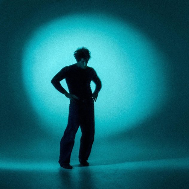 Clutter cover: a silhouette in a teal spotlight